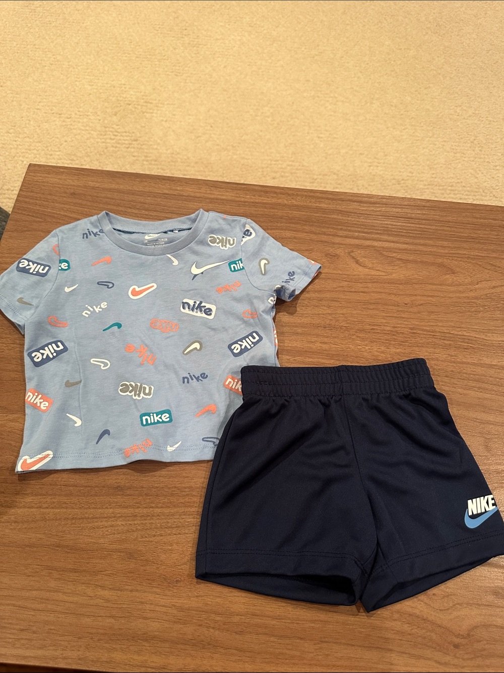 Nike Light Blue Graphic Tee with Navy Shorts